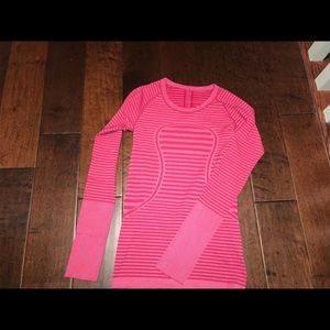 Pink stripped lululemon long sleeve workout top.